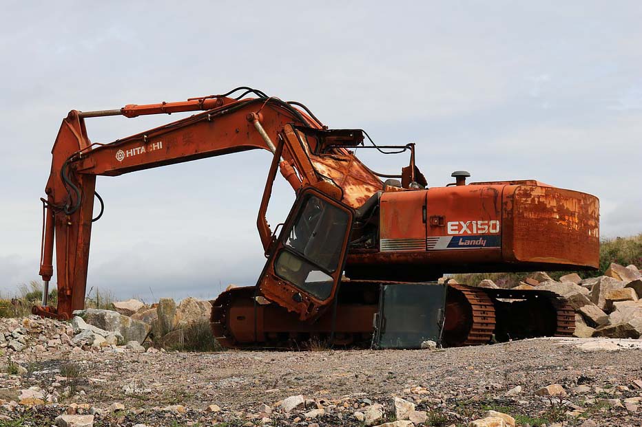 Photo showing abandoned Excavator in corrosive environment
